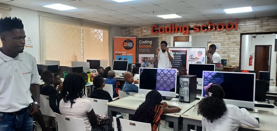 Participants working at computer stations in the ODC Liberia Coding School